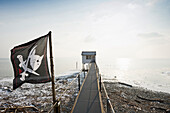 Stilted house with pirate flag, Wasserburg, Lake Constance, Bavaria, Germany