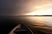 Rowing boat on Lake Starnberg at sunset, Upper Bavaria, Germany, Europe