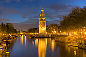 Montelbaanstoren with Oude Schans at dusk, Amsterdam, North Holland, The Netherlands