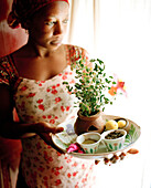 Therapist Acha shows ingredients for henna paste, Mrembo Spa, Mrembo means beautiful woman, old house in the center of Stone Town, Zanzibar, Tanzania, East Africa