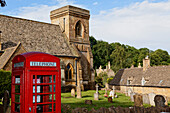 Telephone booth in front of St. Barnabas church, Snowshill, Gloucestershire, Cotswolds, England, Great Britain, Europe