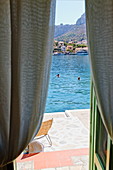 View from Hotel Mediterraneo onto coast area and ocean, Kastelorizo Megiste, Dodecanese Islands, Greece, Europe