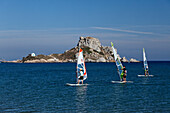 View from Agios Stefanos onto sailboarders in front of the peninsula of Kefalos, Kos, Dodecanese Islands, Greece, Europe