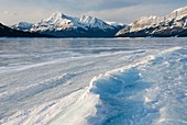 Sunrise over the wind blasted surface of Abraham Lake, Alberta Canada