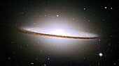 NASA´s Hubble Space Telescope has trained its razor-sharp eye on one of the universe´s most stately and photogenic galaxies, the Sombrero galaxy, Messier 104 M104  The galaxy´s hallmark is a brilliant white, bulbous core encircled by the thick dust lanes