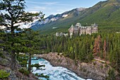 The imposing Banff Springs Hotel with Bow River, Banff National Park, Alberta, Canada