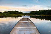 Canoe on the water of Stillwater River, Orono