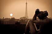 Eiffel Tower and sculptures at sunset from Tuileries Garden  Paris, France