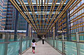 A wide-angle perspective emphasizes the graphic design elements in the Park Bridge passage leading from Midtown Plaza to Hinokicho Park at the Midtown Tokyo business complex, located in the upscale Roppongi district of central Tokyo, Japan.