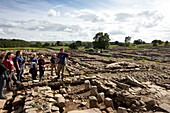 Andrew Birley head of the archaeological excavation Vindolanda with volunteers, The Roman Vindolanda Fort, World Heritage Site, Bardon Mill, Hexham, Northumberland, England, Great Britain, Europe