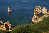 Rock formations and boats, Praio do Camilo, Ponta da Piedade, near Lagos, Algarve, Portugal, Europe