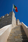 Fortress tower and Portuguese flag at Loule, Loule, Algarve, Portugal, Europe