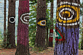 Painted trunks of trees, El bosque pintado de Oma, El bosque animado de Oma, Miran igual que tu, They are looking like you, Kortezubi, Guernica, natural reserve of Urdaibai, province of Bizkaia, Basque Country, Euskadi, Northern Spain, Spain, Europe