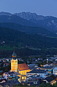View over Schladming at night with Schladming Parish Church and Anna chapel, Ennstal, Steiermark, Austria