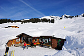 Snow covered alpine hut with Gebra in background, Hochwildalmhuette, Gebra, Kitzbuehel range, Tyrol, Austria, Europe