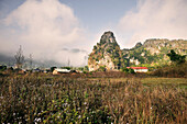 Caves of the Pathet Lao beneath fog and clouds, history communism, Vieng Xai near Xam Neua, Highlands, Laos