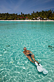 Woman snorkeling at Kurumba Island, North Male Atoll, Indian Ocean, Maldives