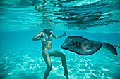 Woman Snorkeling with Stingray