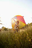Boy With Kite On Grassland