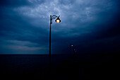 Streetlights along pier at night. Streetlights along pier at night