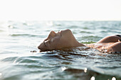 Woman floating in water. Woman floating in water