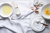 Sugar, butter, eggs and milk on table. OpenerStartersA