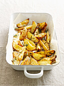 Dish of roasted potatoes with herbs