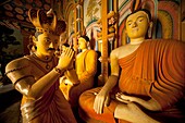 statues of Buddha and worshippers at Wewurukannala Vihara Temple near Dikwella, Pussalagoda, Sri Lanka, Walasgala