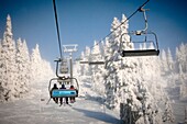 View of Skiers at the chair lift in Cerna Hora Ski Resort, Karkonosze, Czech Republic