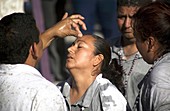 A medium heals a pilgrim during Nino Fidencio celebrations in Espinazo, Nuevo Leon state, Mexico.