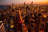 Sunset over the Chicago skyline looking south from the Hancock Tower along the lake front in Chicago, IL, USA