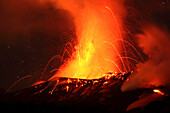Red hot lava and sparks erupting from the Tavurvur Volcano at night, Rabaul, East New Britain, Papua New Guinea, Pacific