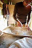 Man cutting a heart into a bread dough, Klein Thurow, Roggendorf, Mecklenburg-Western Pomerania, Germany