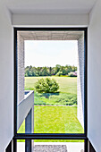 View out of a window to a garden, Neuenkirchen, North Rhine-Westphalia, Germany