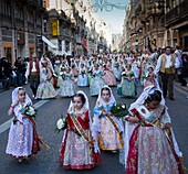 'Spain-Valencia Community-Valencia City-Valencian people in traditional costumes at Flower Offering to the ''Desemparados Virgin'' during the San Jose Festivities'