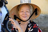 Asia, Southeast Asia, Vietnam, Centre region, Hoi An, portrait of an old woman wearing a conical hat
