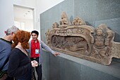 Vietnam,Danang,Museum of Cham Sculpture,Tourists Looking at Sandstone Carving