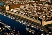 France, Gard (30), Aigues-Mortes, a fortified city, surrounded by ramparts of the XIII century, the Tower of Constance and the Canal du Rhone at Sète, (aerial view)