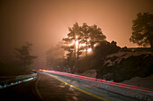 Streaking Car Lights on Road at Sunset in Winter