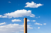 Tall brick chimney extending towards sky, Wendover, Utah, USA., A tall brick chimney