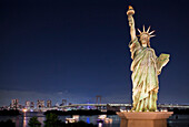 Statue of Liberty with Tokyo Bay, skyline and Rainbow Bridge in the background, Night over Obaida, Tokyo., Statue of Liberty in Tokyo Bay, Japan