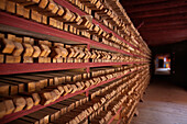 Derge Parkhang Printing House built in 1729. Rows of printing blocks, in racks. Stored. Religious texts. Printing equipment., Sichuan Tibet