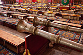 Dzogchen Monastery a religious institution, founded between 1625 and rebuilt at least twice since. Maintained as a centre of Buddhist teaching and education. Rows of traditional wooden trumpets, musical instruments., Sichuan Tibet