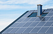 Photovoltaic solar panels mounted on the roof of a German house., Solar panels in Germany