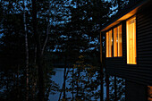 Cottage on Lake at Night