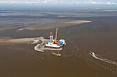 Aerial view of the construction of a wind turbine power plant in the North Sea, Cuxhaven, Lower Saxony, Germany