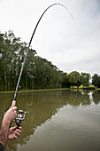 One man is fishing, carp pond, Elsass,  France