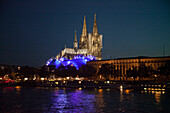 Cologne Cathedral and Cologne Musical Dome at night seen from Rhine river cruise ship MS Bellevue, Cologne, North Rhine-Westphalia, Germany, Europe