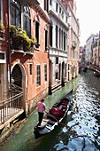 Gondolas on the narrow canals of Venice, Italy