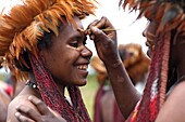 Portrait of two local Papuan girls, getting traditional face painting, Baliem Valley festival, Jayawijaya region, Papua, Indonesia, Southeast Asian